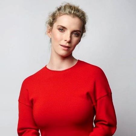 Cosmo Pfeil's wife Betty Gilpin has similar height as him.